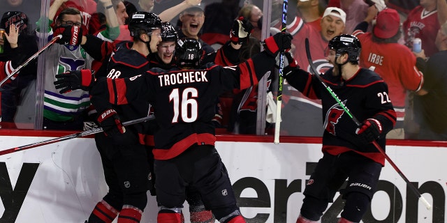 Andrei Svechnikov of the Hurricanes celebrates a goal with teammates during Game 5 of the second-round playoff game against the New York Rangers on May 26, 2022, at PNC Arena in Raleigh, North Carolina.