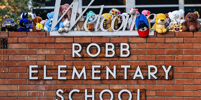 Memorabilia decorate a makeshift memorial for the victims of the shooting outside Robb Elementary School in Uvalde, Texas, May 28, 2022. 