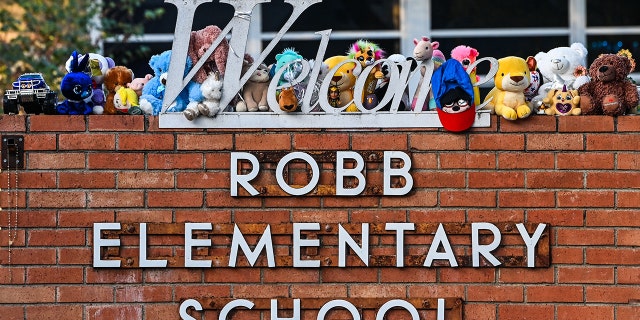 Mementos decorate a makeshift memorial for the shooting victims outside Robb Elementary School in Uvalde, Texas, on May 28, 2022.