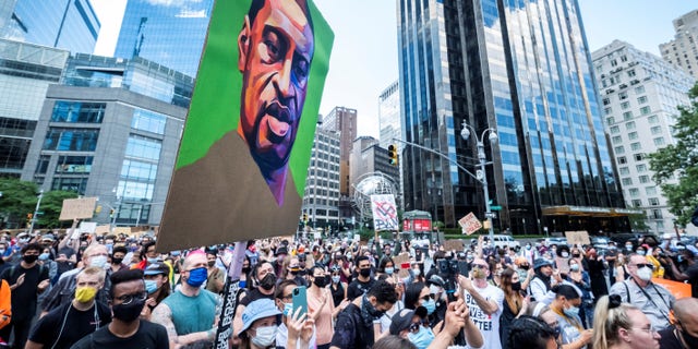 George Floyd portrait in front of Trump International Hotel and Tower at Columbus Circle on June 14, 2020.