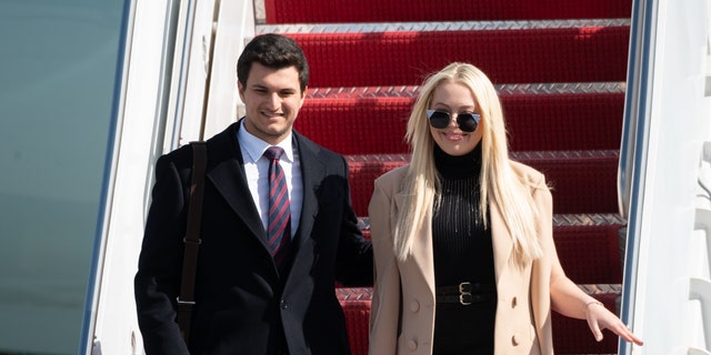 Tiffany Trump (R) and Michale Boulos exit Air Force One at the Palm Beach International Airport on the way to Mar-a-Lago Club on January 20, 2020 in West Palm Beach, Florida.