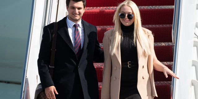 Tiffany Trump (R) and Michale Boulos exit Air Force One at the Palm Beach International Airport on the way to Mar-a-Lago Club on January 20, 2020 in West Palm Beach, Florida.