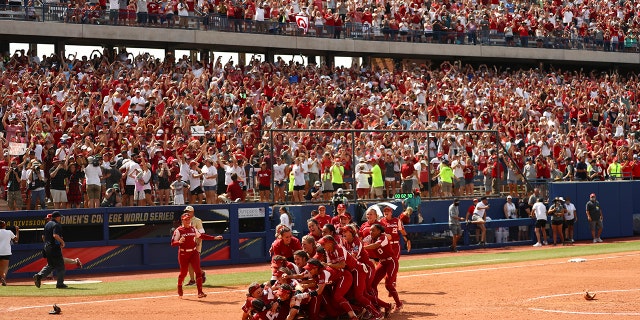 Oklahoma City celebrates after defeating Florida St. Seminoles at the Division I Women's Softball Championship at the ASA Hall of Fame Stadium on June 10, 2021 in Oklahoma City.