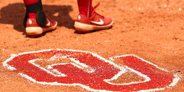 The Oklahoma Sooners logo in the soil during the match between the Oklahoma Sooners and the Florida St. Seminoles at the Division I Women's Softball Championship at the ASA Hall of Fame Stadium on June 10, 2021 in Oklahoma City. 