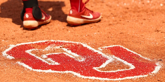 The Oklahoma Sooners logo in the dirt during a game between the Oklahoma Sooners and the Florida St. Seminoles during the Division I women’s softball championship at ASA Hall of Fame Stadium June 10, 2021, in Oklahoma City. 