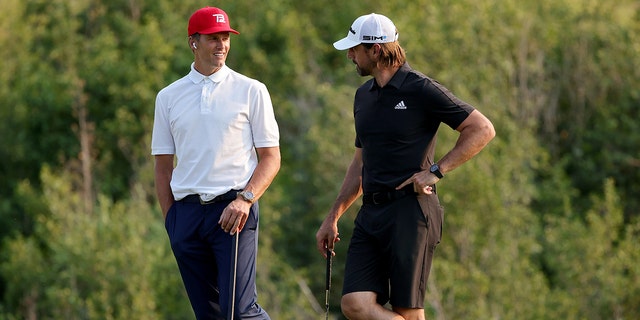Tom Brady, left, and Aaron Rodgers meet during Capital One's match at The Reserve at Moonlight Basin on July 6, 2021 in Big Sky, Mont. 