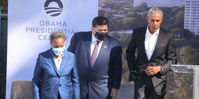Illinois Governor J.B. Pritzker (C) and Chicago Mayor Lori Lightfoot (L) join former U.S. President Barack Obama during a ceremonial groundbreaking at the Obama Presidential Center in Jackson Park on September 28, 2021 in Chicago, Illinois. Construction of the center was delayed by a long legal battle undertaken by residents who objected to the center being built in a city park.
