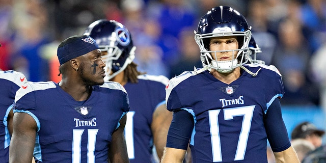 Ryan Tannehill #17 and A.J. Brown #11 of the Tennessee Titans talk on the field during a game against the Buffalo Bills at Nissan Stadium on October 18, 2021, in Nashville, Tennessee.  The Titans defeated the Bills 34-31. 