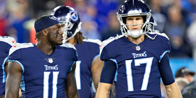 Ryan Tannehill #17 and A.J. Brown #11 of the Tennessee Titans talk on the field during a game against the Buffalo Bills at Nissan Stadium on October 18, 2021, in Nashville, Tennessee. The Titans defeated the Bills 34-31.