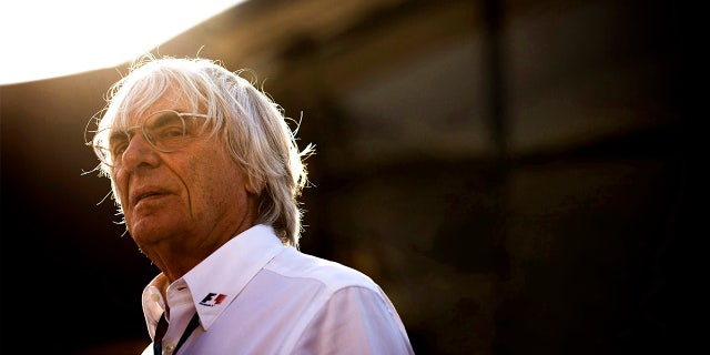 British Chief Executive Of The Formula One Group Bernie Ecclestone wearing a logo adorned white shirt while standing in the Formula One paddock at the 2013 German Grand Prix, Nurburgring, Alemania, on the 6th July 2013.