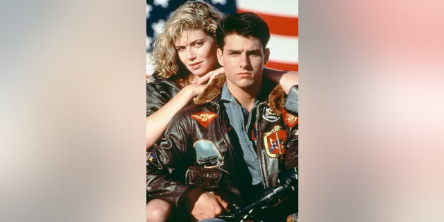 American actors Tom Cruise, as Lieutenant Pete 'Maverick' Mitchell, and Kelly McGillis, as Charlotte 'Charlie' Blackwood, in a promotional portrait for 'Top Gun' in 1986.