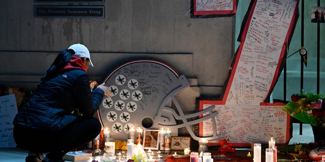 A vigil is held at Ohio Stadium in memory of former Buckeye Dwayne Haskins Jr. on April 12, 2022, in Columbus, Ohio. 