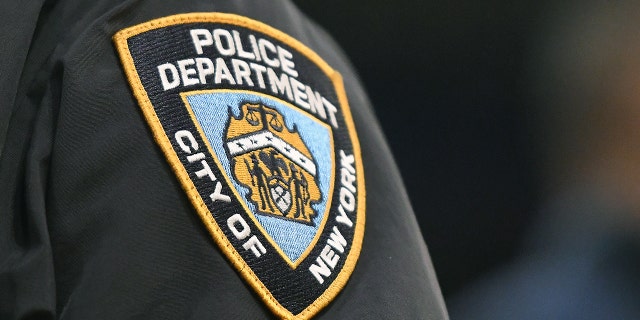 FILE- NEW YORK, NEW YORK - MARCH 11: NYPD logo on the sleeve of a New York City policeman.