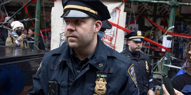 FILE- Police enforce a sweep of a homeless encampmenton May 4, 2022 in the East Village neighborhood of New York City, New York.