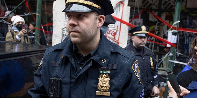 FILE- Police enforce a sweep of a homeless encampmenton May 4, 2022 in the East Village neighborhood of New York City, New York.