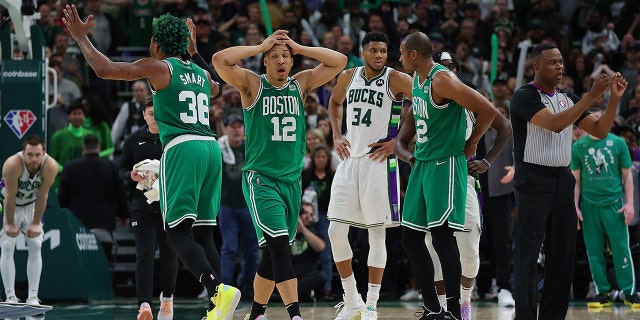 Grant Williams (12) and Marcus Smart (36) of the Boston Celtics react to an official call during Game 3 of the Eastern Conference Semi-Finals against the Milwaukee Bucks at the Fiserv Forum on May 7, 2022 in Milwaukee.