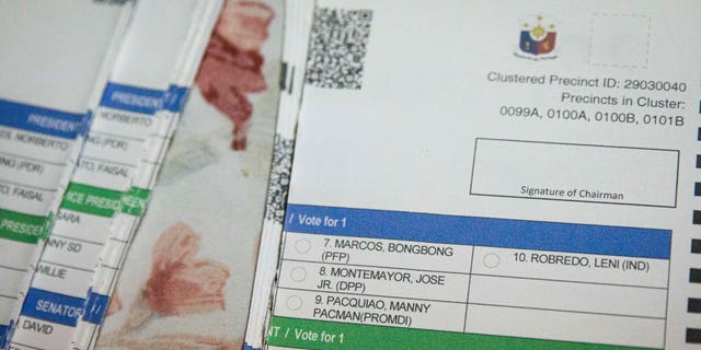 Presidential candidates Ferdinand "Bongbong" Marcos Jr. and Leni Robredo's names are seen on a destroyed unused ballot on election day on May 09, 2022 in Vigan, Philippines.