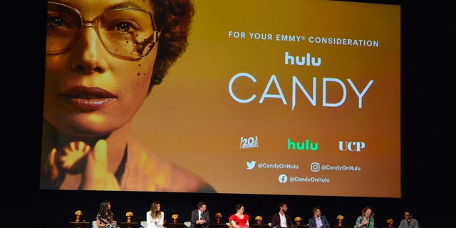 Moderator Rebecca Ford, Jessica Biel, Timothy Simons, Melanie Lynskey, Pablo Schreiber, Raul Esparza, Showrunner Robin Veith and Executive Producer Nick Antosca participate in a panel during the Los Angeles Premiere FYC Event For Hulu's 'Candy' at El Capitan Theatre on May 09, 2022 in Los Angeles, California.