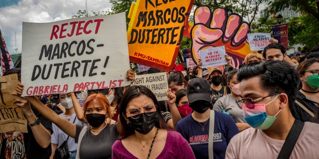 Filipinos take part in a protest against election results outside the Commission on Elections on May 10, 2022, in Manila, Philippines. (Ezra Acayan/Getty Images)