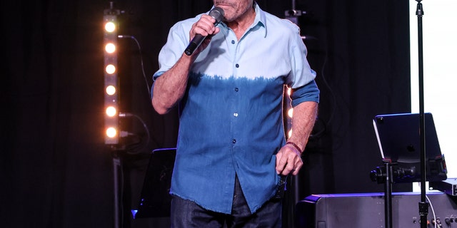 Lee Greenwood is shown performing on stage during a Music Memorial for Jeff Carson at Nashville Palace on May 10, 2022, in Nashville, Tenn. 