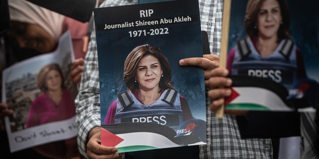 Tributes are paid to murdered Palestinian journalist Shireen Abu Akleh at a protest and vigil at BBC Broadcasting House on May 12, 2022 in London, England.