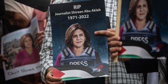 Tributes are paid to murdered Palestinian journalist Shireen Abu Akleh at a protest and vigil at BBC Broadcasting House on May 12, 2022 in London, England. 