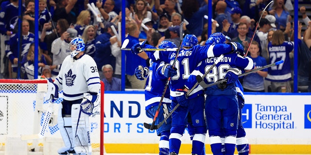 Lightning players celebrate a goal in the third period during the Stanley Cup playoffs against the Toronto Maple Leafs on May 12, 2022, in Tampa, Florida.