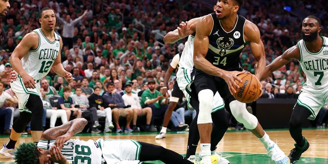 Giannis Antetokounmpo of the Milwaukee Bucks drives to the basket against the Celtics during Game 7 of the Eastern Conference Semifinals at TD Garden on May 15, 2022, in Boston.