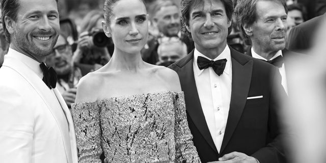 Glen Powell, Jennifer Connelly, Tom Cruise and Jerry Bruckheimer attend the screening of "Top Gun: Maverick" at the Cannes Film Festival.