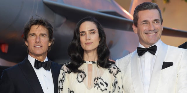 (L-R) Tom Cruise, Jennifer Connelly and Jon Hamm attend the Royal Film Performance screening of "Top Gun: Maverick" in London. 