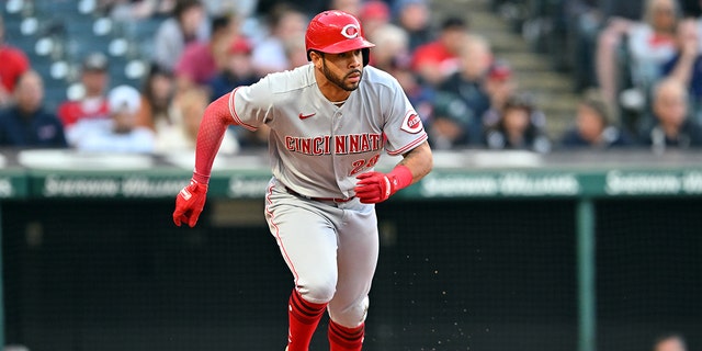 Tommy Pham #28 of the Cincinnati Reds runs out an RBI single during the eighth inning against the Cleveland Guardians at Progressive Field on May 17, 2022 in Cleveland, Ohio. 