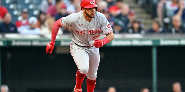 Tommy Pham #28 of the Cincinnati Reds runs out an RBI single during the eighth inning against the Cleveland Guardians at Progressive Field on May 17, 2022 en cleveland, Ohio.