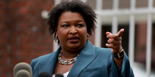 Georgia's Democratic gubernatorial nominee Stacey Abrams warned businesses looking to do business in Georgia to "take into very real consideration the danger" Republican Gov. Brian Kemp poses on women in Georgia if abortion ban goes into effect. 