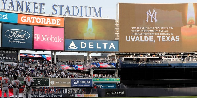 A moment of silence is observed for victims of the Texas elementary school massacre at Yankee Stadium prior to a game between the New York Yankees and the Baltimore Orioles on May 25, 2022, a New York City. 