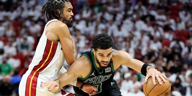 The Heat's Gabe Vincent defends Jayson Tatum of the Boston Celtics during the fourth quarter at FTX Arena on May 25, 2022 a Miami, Florida.