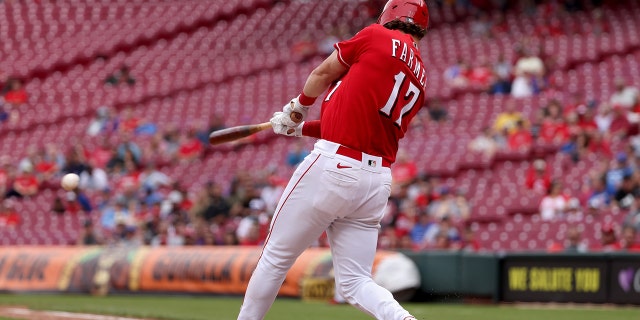 Kyle Farmer of the Cincinnati Reds hits a single in the sixth inning against the Chicago Cubs at the Great American Ball Park on May 26, 2022 in Cincinnati.