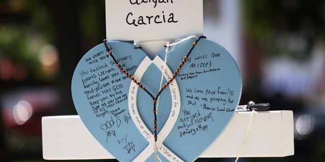 A memorial for victims of Tuesday's mass shooting at an elementary school, are seen in a park along Main Street on May 26, 2022 a Uvalde, Texas.