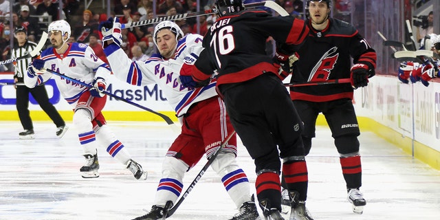 Frank Vatrano of the New York Rangers is stopped by the Hurricanes' Brady Skjei at PNC Arena on May 26, 2022, in Raleigh, North Carolina.