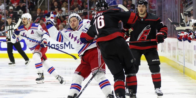 Frank Vatrano of the New York Rangers is stopped by the Hurricanes' Brady Skjei at PNC Arena on May 26, 2022, in Raleigh, North Carolina.