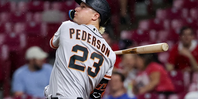 Joc Pederson of the San Francisco Giants flies out in the fourth inning against the Cincinnati Reds at Great American Ball Park May 27, 2022, in Cincinnati. 
