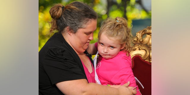 An old photo of June Shannon with Alana Thompson