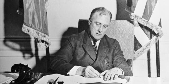 FDR signs the Emergency Banking Act. Across the 12 years of his presidency, he would give over 30 "fireside chats" in an effort to help the American people understand and navigate challenging times.