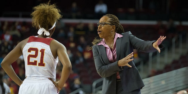 USC Trojans head coach Cynthia Cooper-Dyke talks with USC Trojans guard Aliyah Mazyck (21) during a timeout of a game between the USC Trojans and the UCLA Bruins at the Galen Center in Los Angeles. 