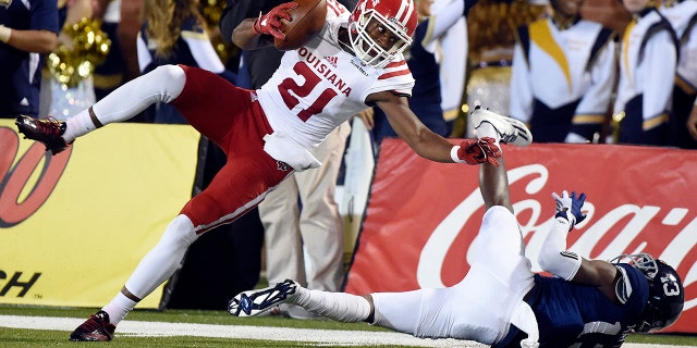 Wide receiver Keenan Barnes (21) of the Louisiana Lafayette Ragin' Cajuns pulls down a pass against cornerback Christian Matthew (13) of the Georgia Southern Eagles Nov. 10, 2016, at Paulson Stadium in Statesboro, Ga.