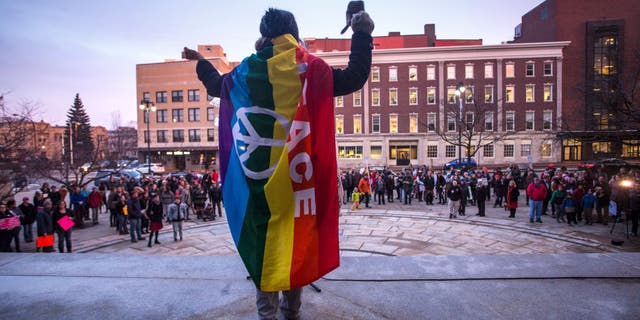 Oliah Fahrenwald of Portland, Maine, speaks to a large crowd during a rally for transgender rights at city hall on March 1, 2019.