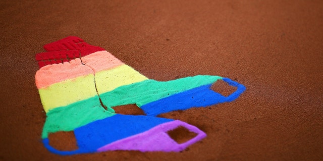 The Fenway Park mound displays the Red Sox logo as a Pride flag in honor of Pride night at Fenway Park before a game between the Detroit Tigers and the Boston Red Sox on June 07, 2018 in Boston, Massachusetts.  