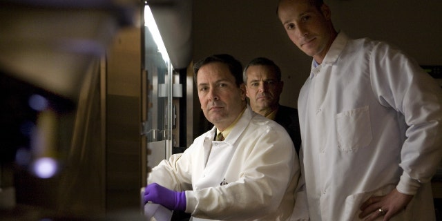 From left, forensic examiner Jason Bannan, Supervisory Special Agent Scott Decker and Supervisory Special Agent Matthew Feinberg, pose for a portrait Oct. 16, 2008 at a lab in Quantico, Va. The three helped solve the anthrax investigation. 