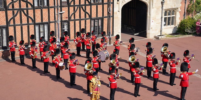 The Band of The Coldstream Guards plays music to mark the 96th birthday of Britain's Queen Elizabeth II during the Changing of the Guard at Windsor Castle, on April 21, 2022.