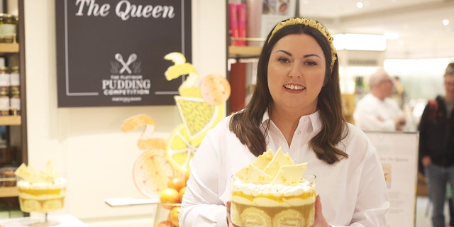 Jemma Melvin in Fortnum and Mason, central London, with her lemon Swiss roll and amaretti trifle that beat 5,000 desserts to become the official pudding of the Queen's Jubilee celebrations.