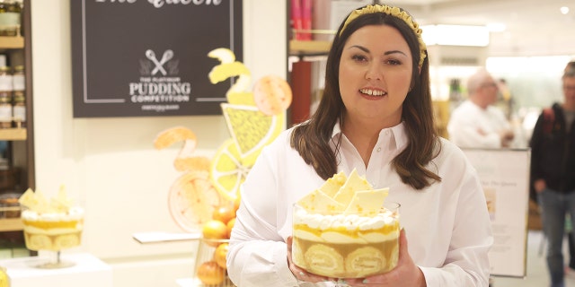 Jemma Melvin in Fortnum and Mason, central London, with her lemon Swiss roll and amaretti trifle that beat 5,000 desserts to become the official pudding of the Queen's Jubilee celebrations.